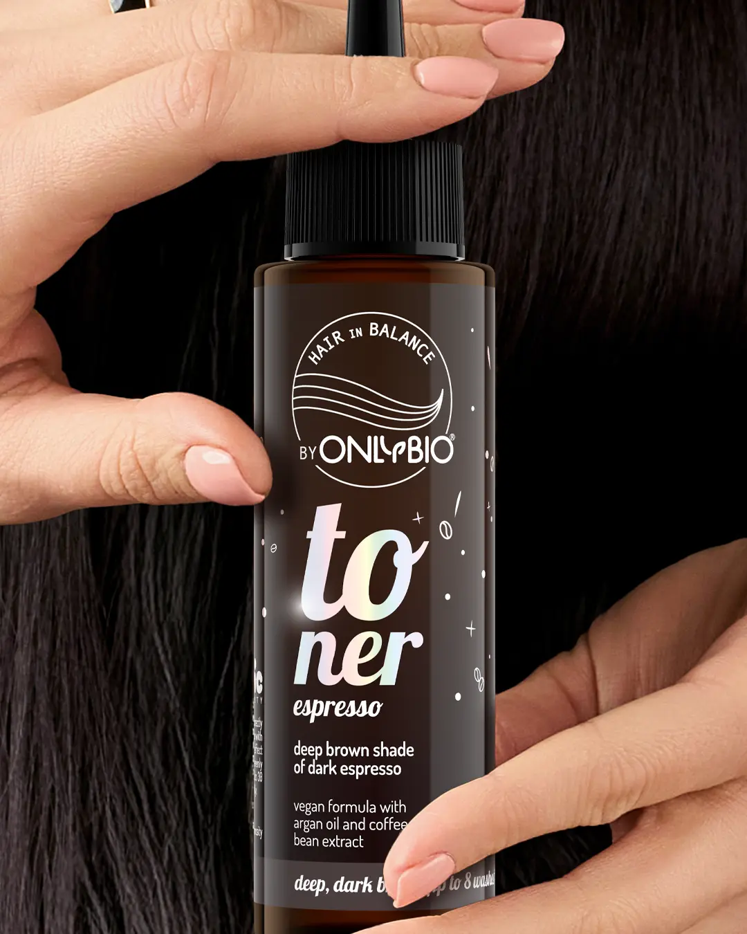 A bottle of OnlyBio hair toner against a background of hair